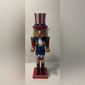 Classic Nutcracker Drummer in Red, white & blue with gold trim.